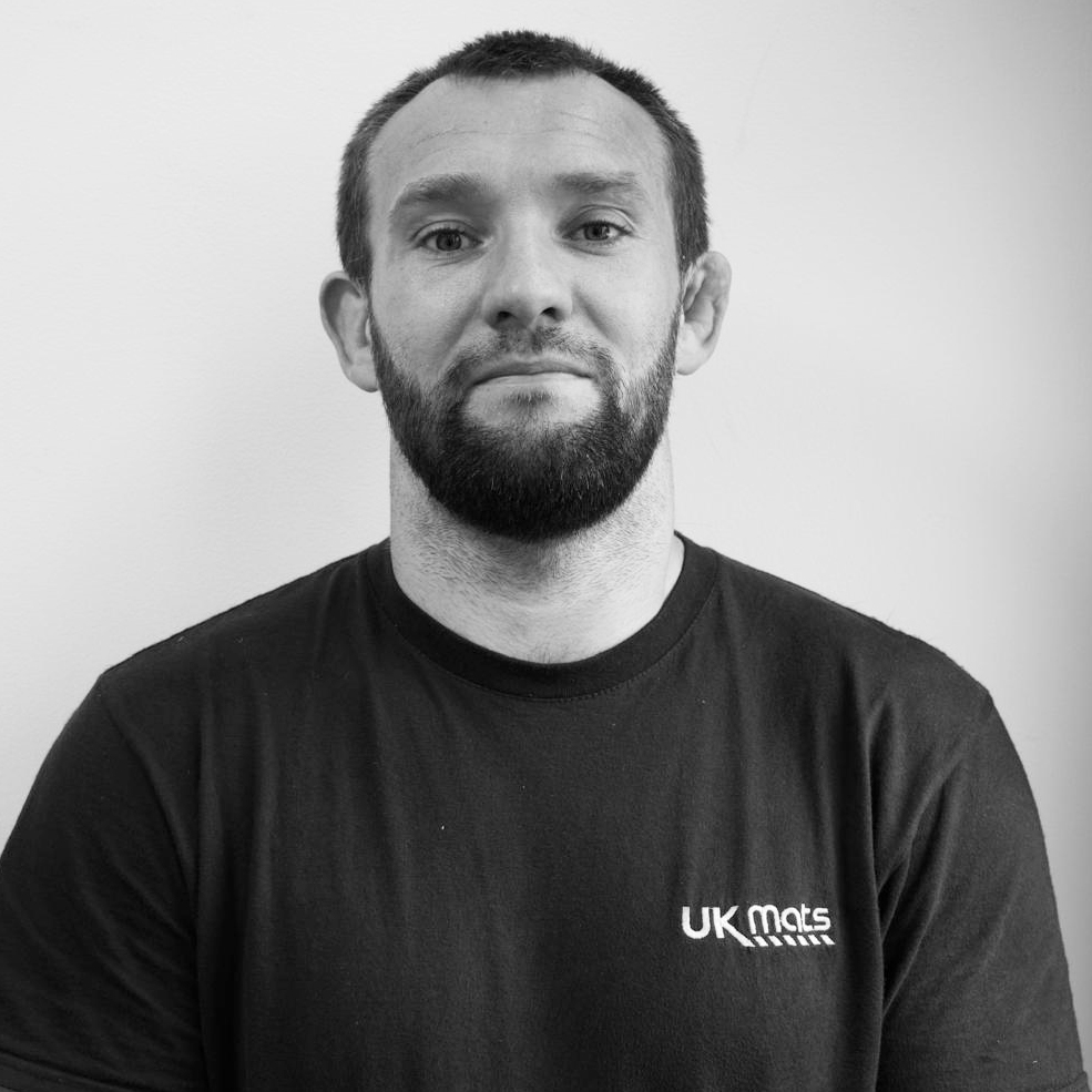 Matt-Dutton-driver-B&W- Matt Dutton driver BW UK Mats Limited